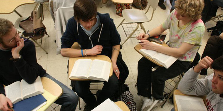 students in a group activity at their desks
